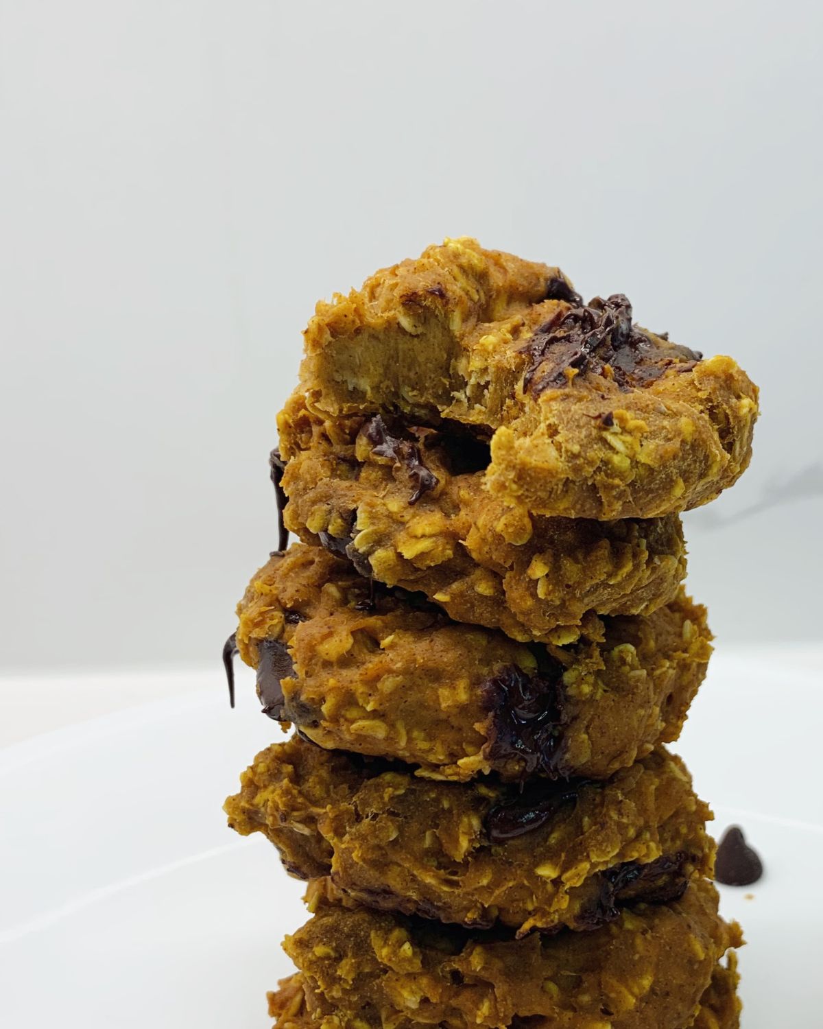 close up of the stack showing 4 cookies top with a bite taken out of it 