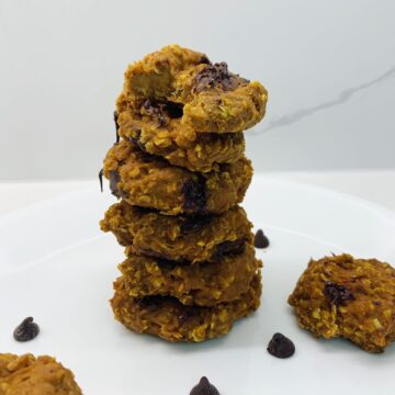 stack of 6 cookies top one with a bite taken out of it