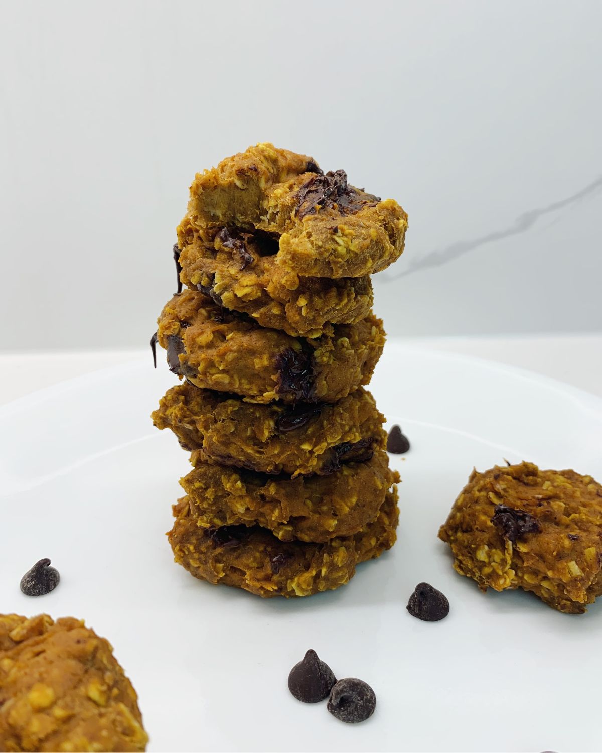 stack of 6 cookies top one with a bite taken out of it