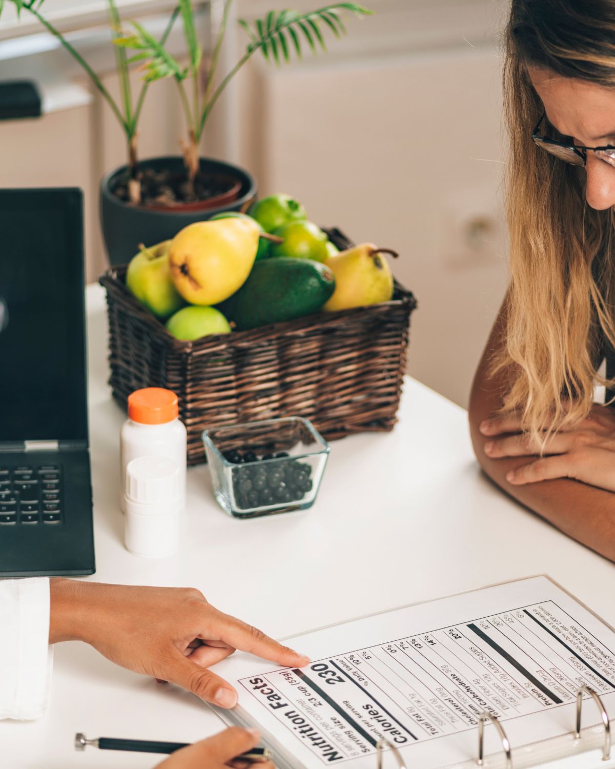 dietitian and client in office going over nutrition facts label 