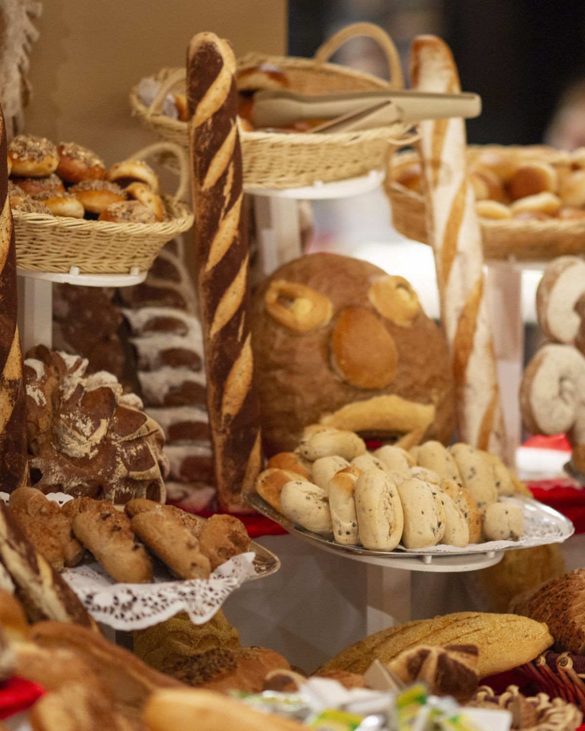 table filled with different breads and baked goods - table of carbohydrates 