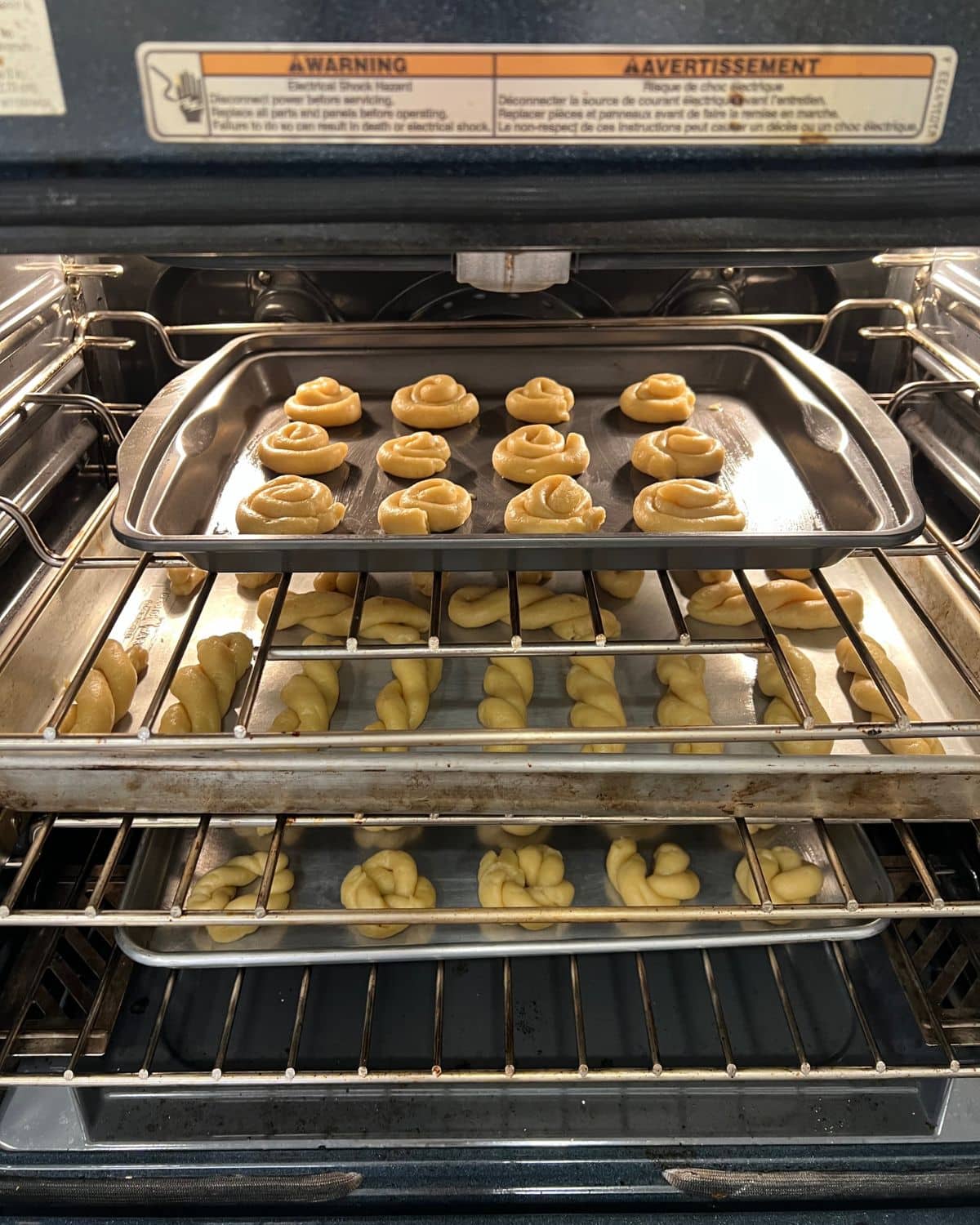 3 trays of cookies in the oven 