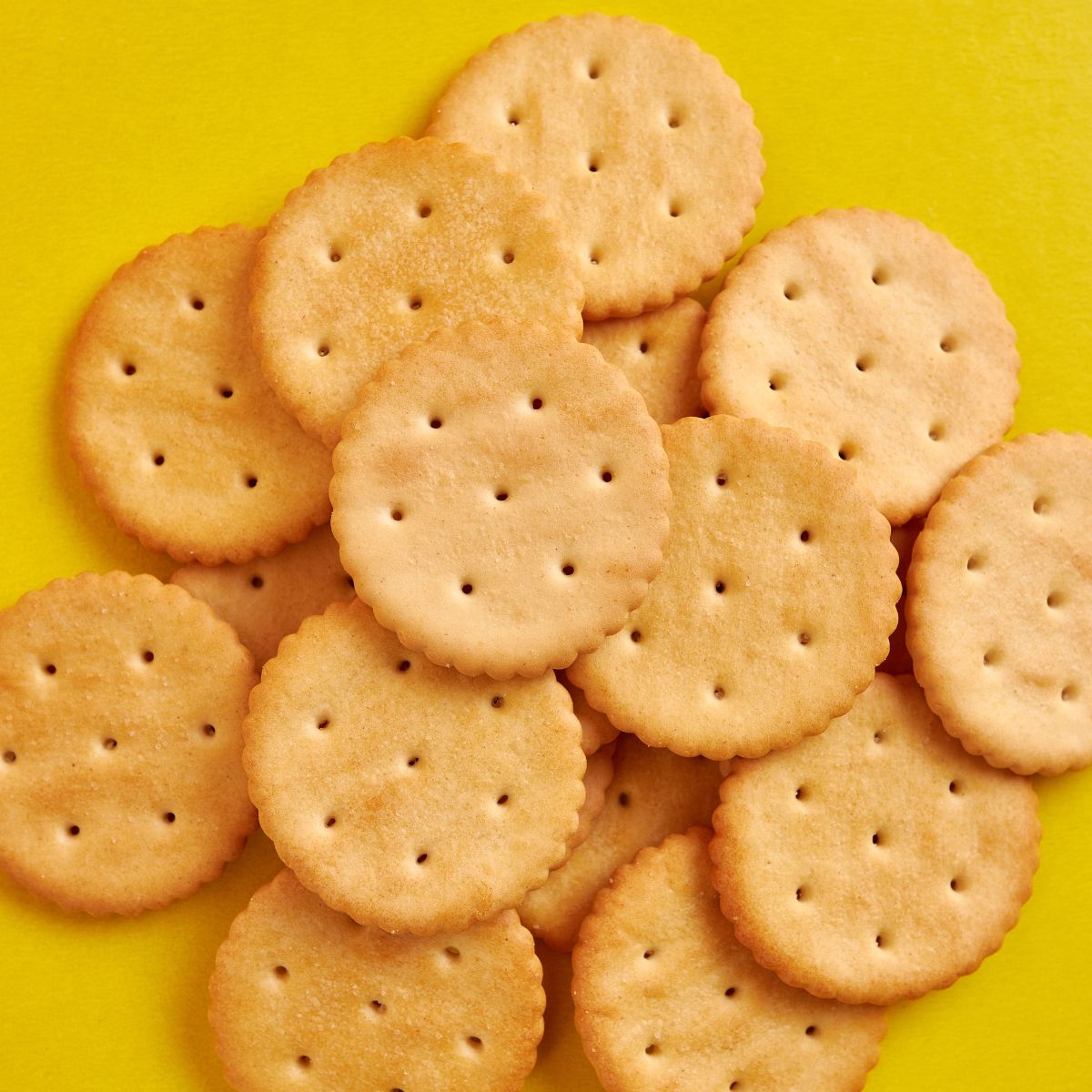 bunch of crackers on a yellow surface