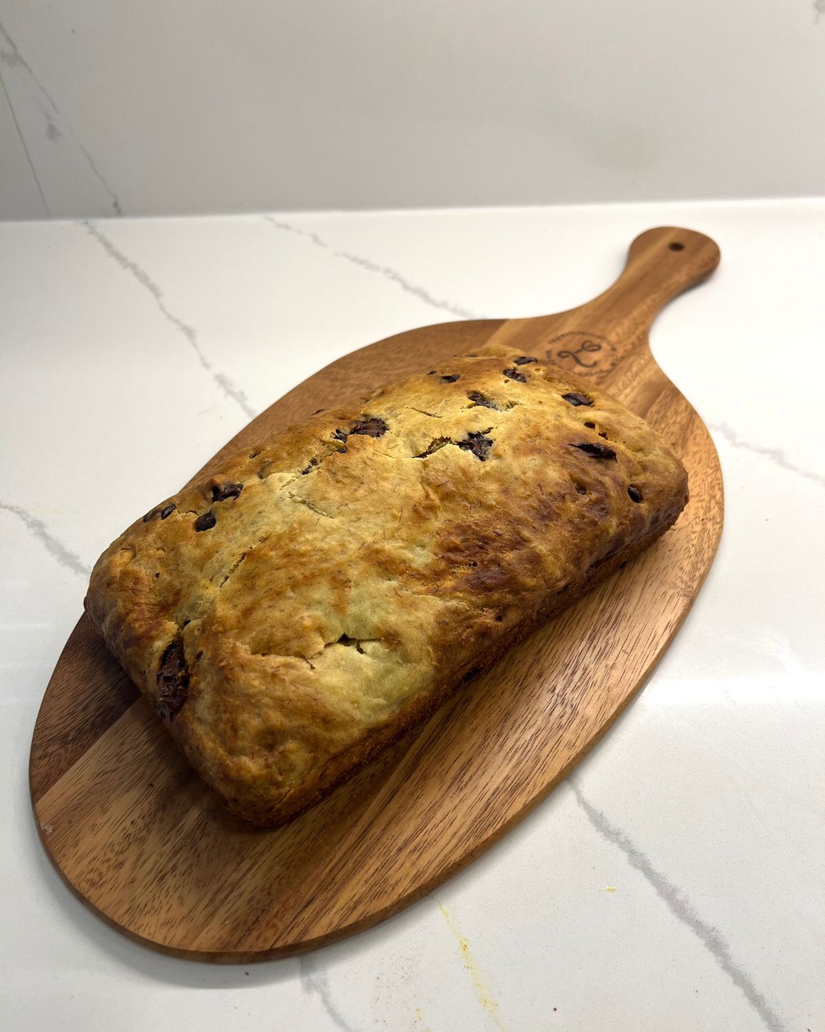 baked banana bread on cutting board 