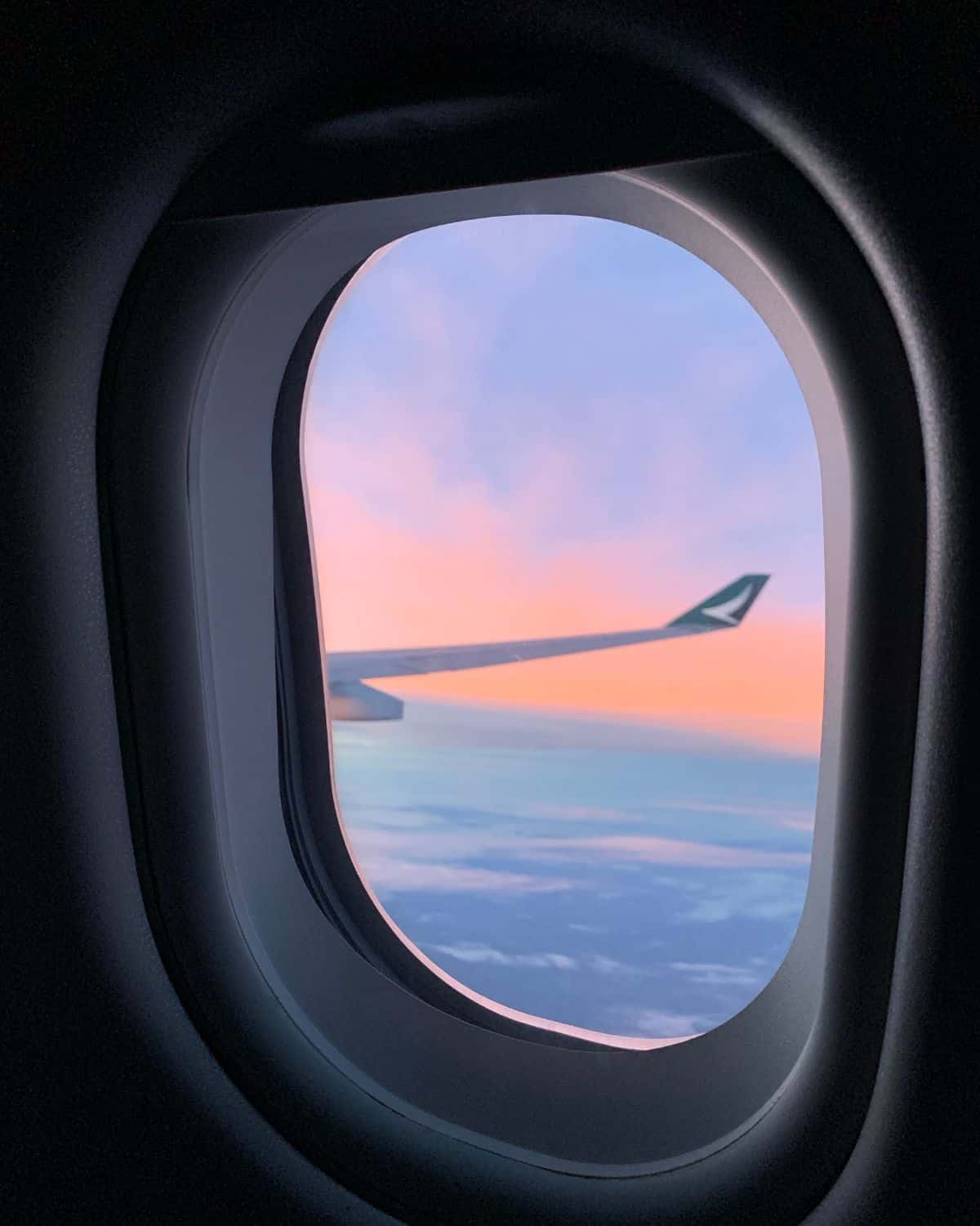 sunset out of plane window