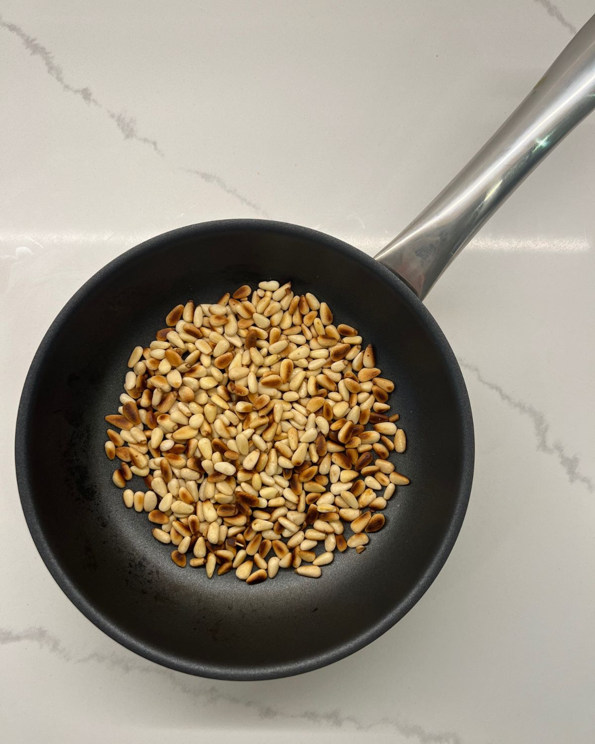 roasted pan nuts in frying pan 