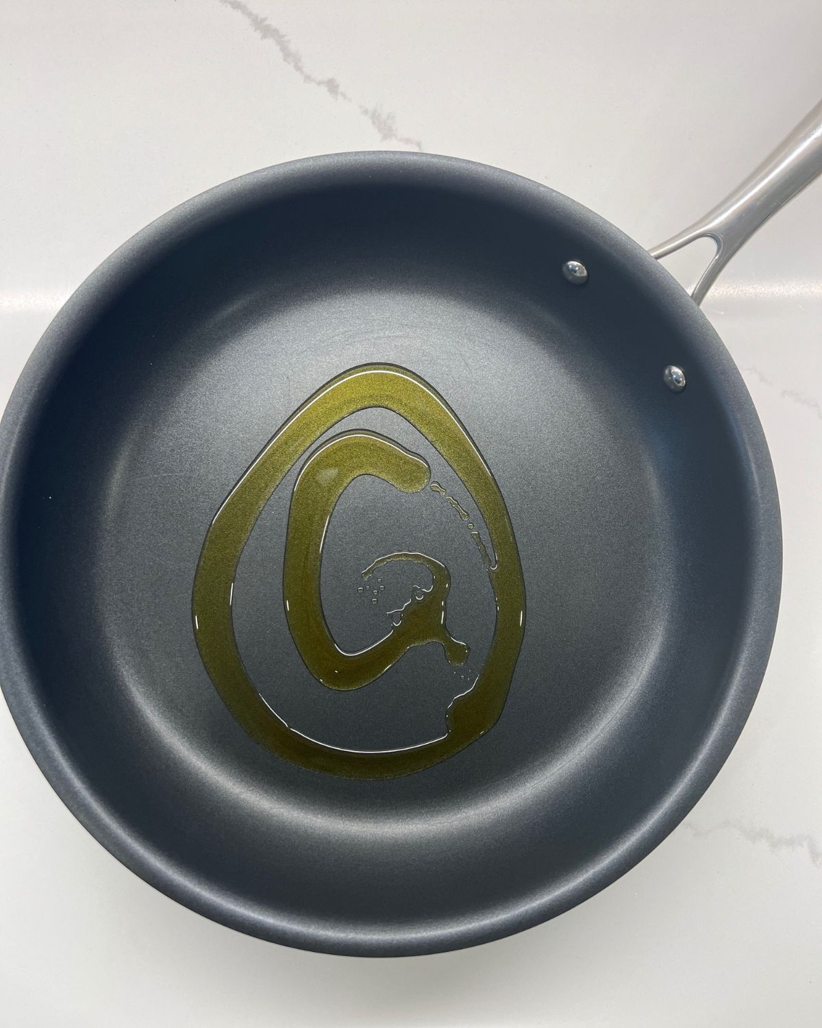 frying pan with olive oil on it 