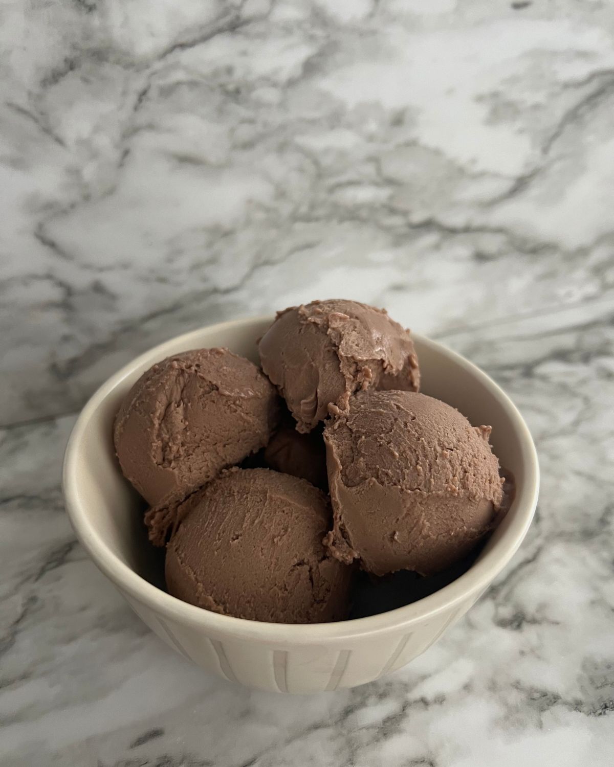 close up image of the scooped ice cream in a bowl 