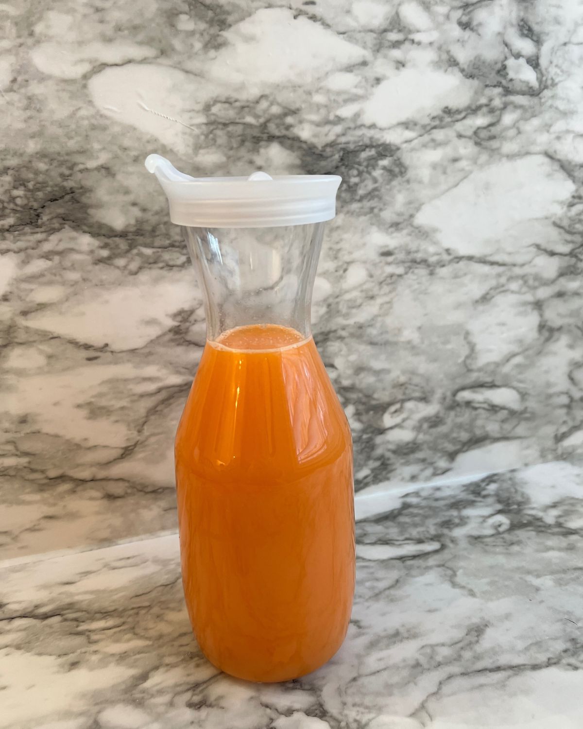 juice poured into a jug to be kept in the fridge 