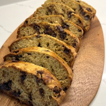 banana bread cut up on cutting board into slices