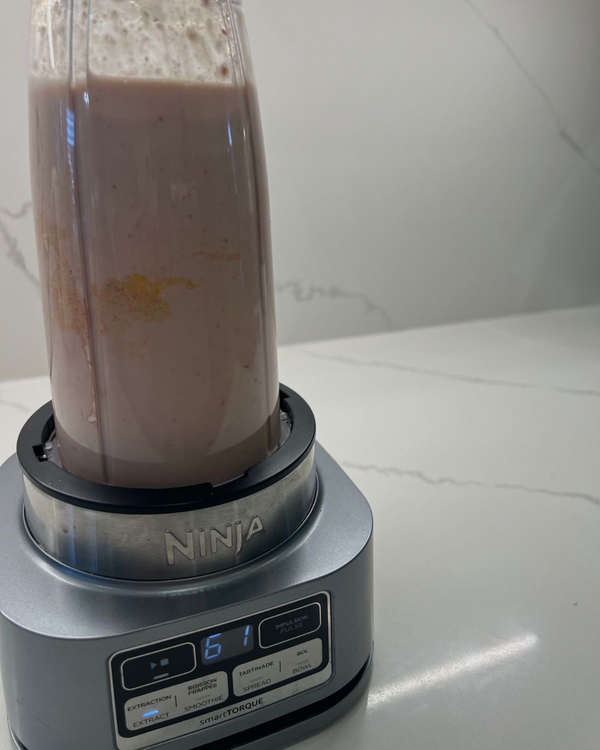 ice cream mixture being blended in blender 