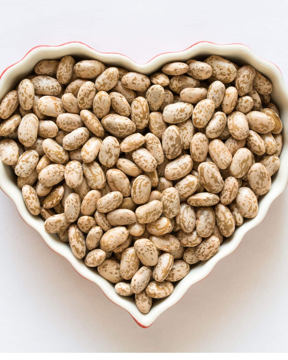 pinto beans in heart shaped bowl 