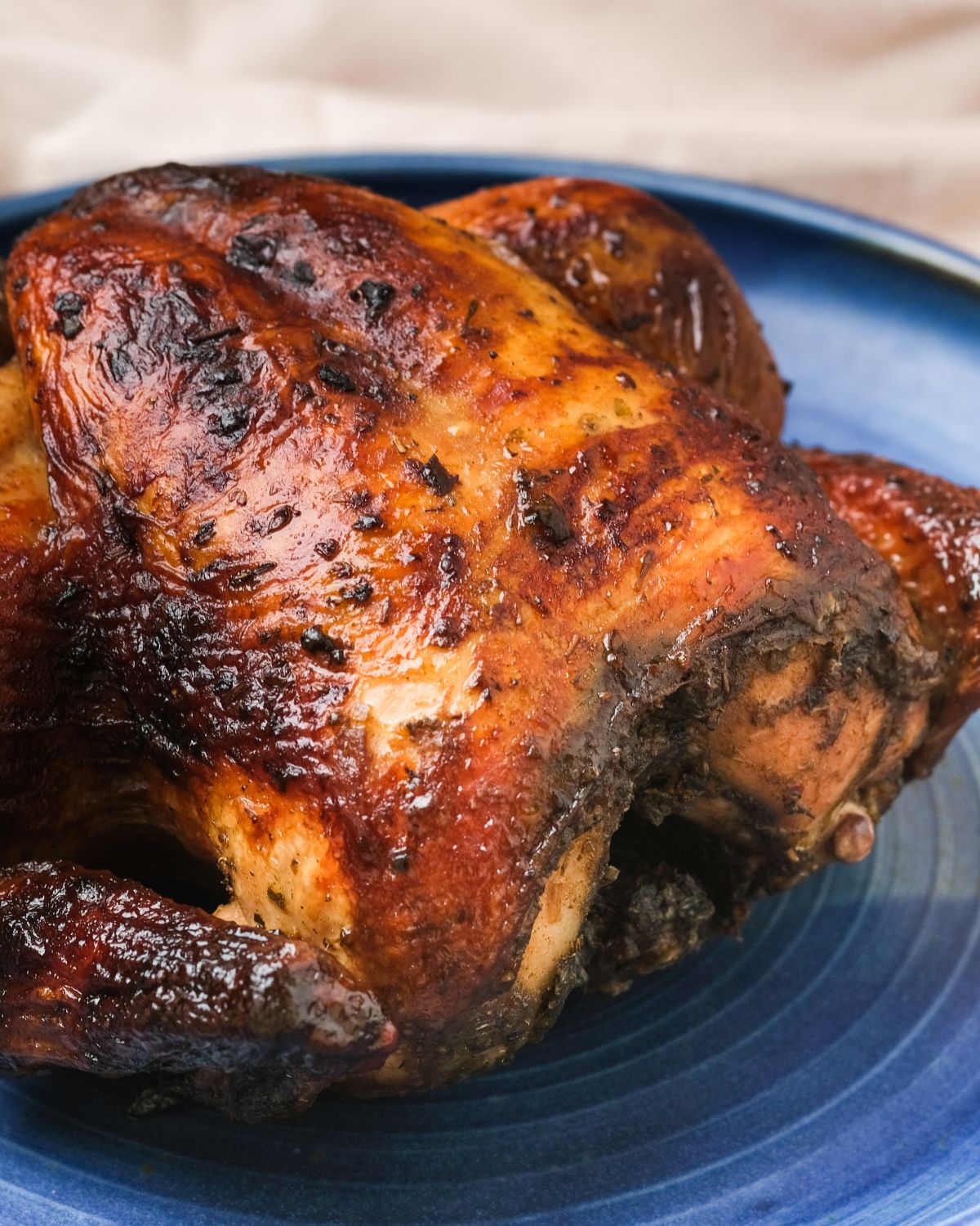 rotisserie chicken on a blue plate 