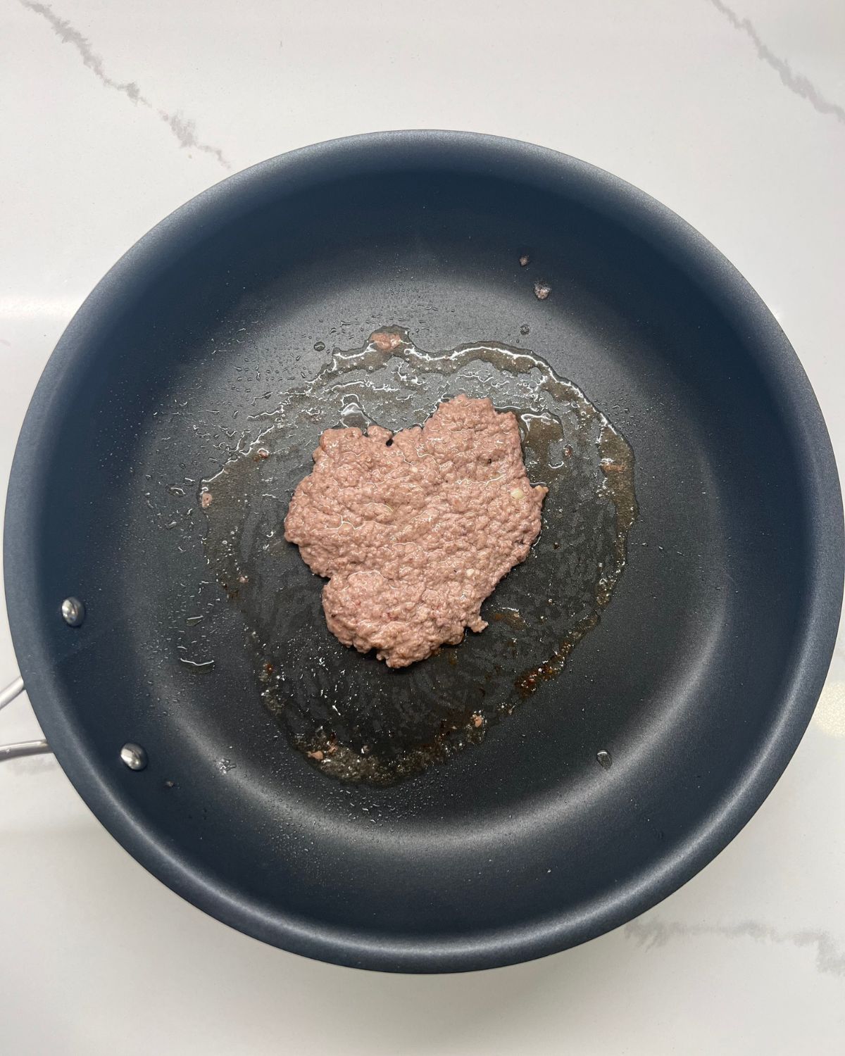 meat on frying pan just flipped 