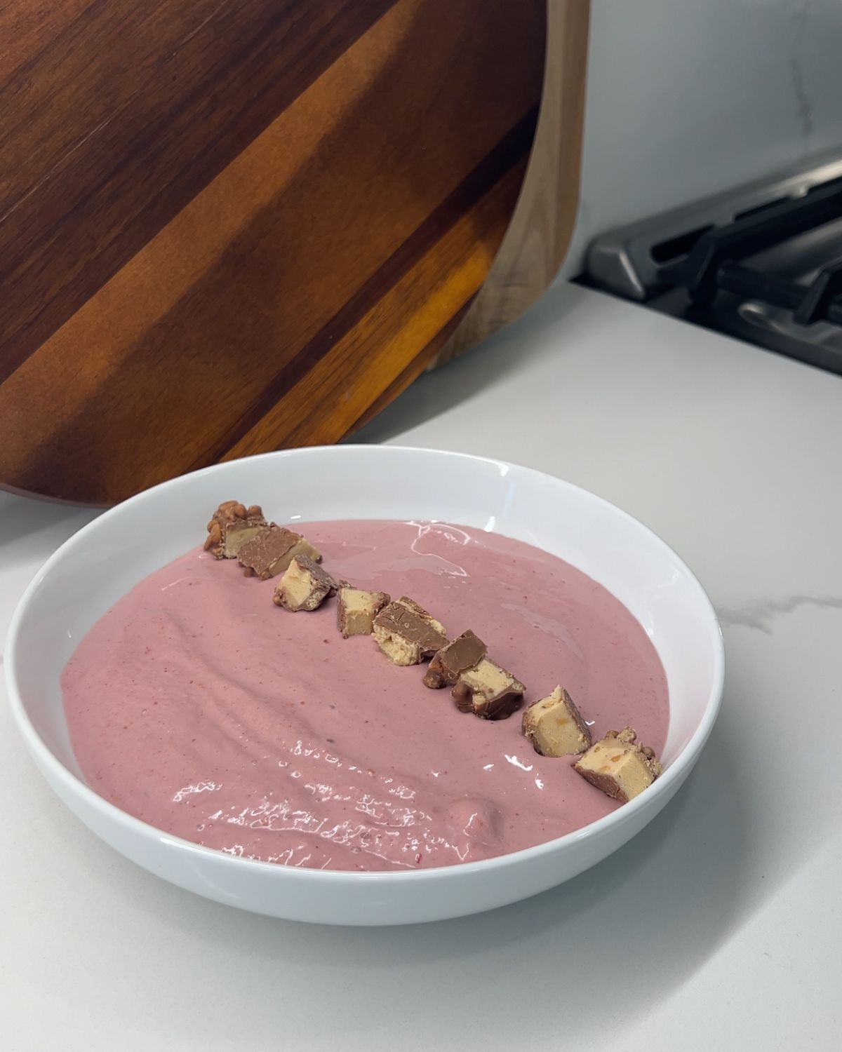 granola bar chucks added to smoothie bowl 