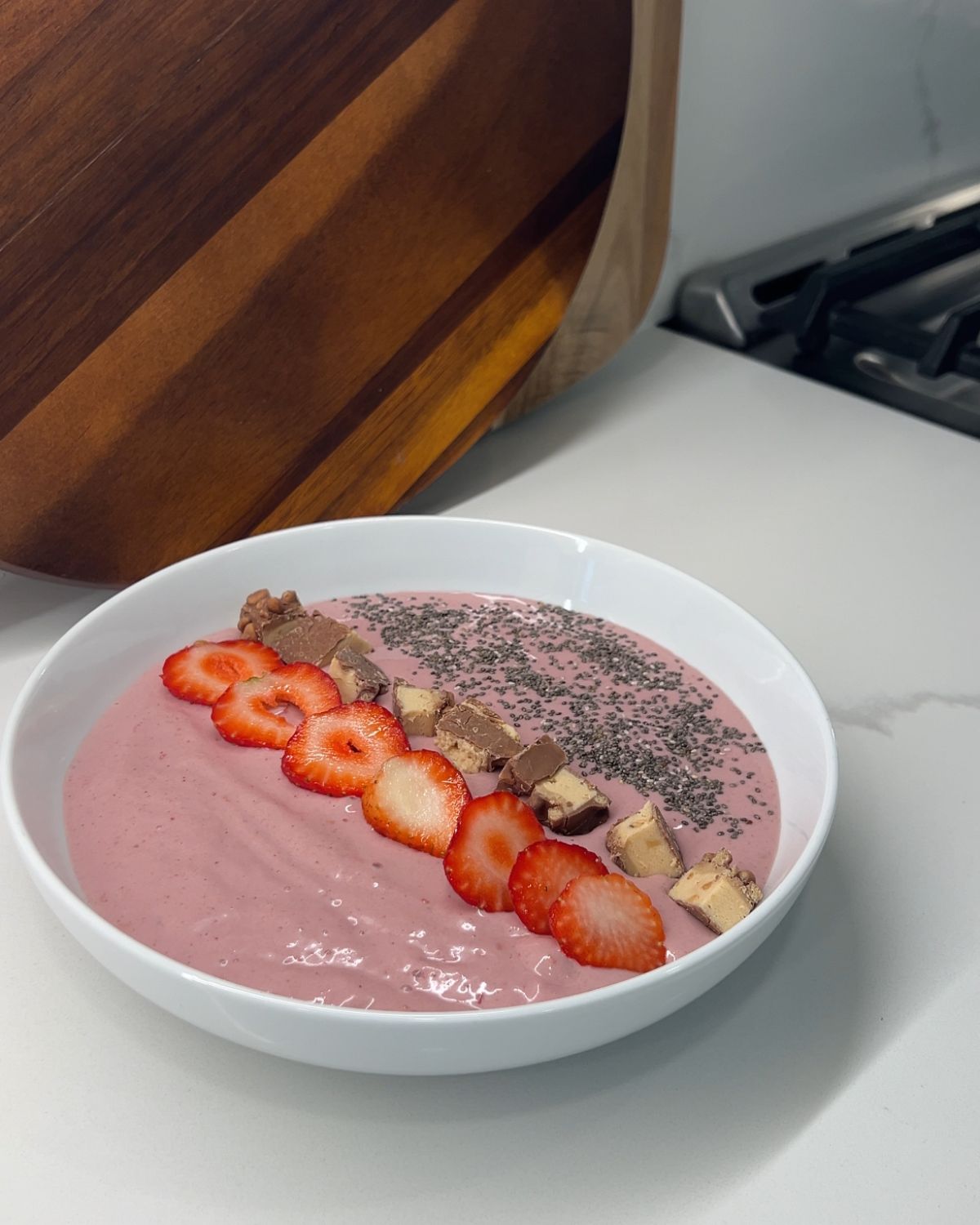 strawberries added to smoothie bowl 