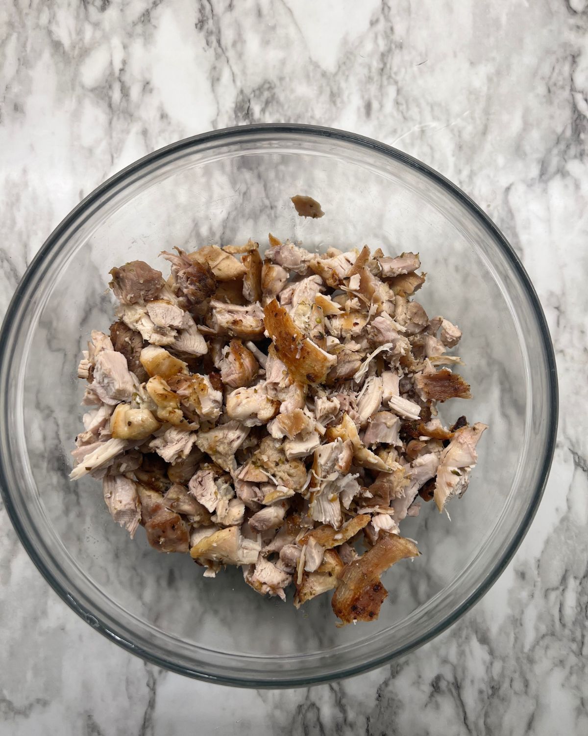 chopped up chicken in bowl 