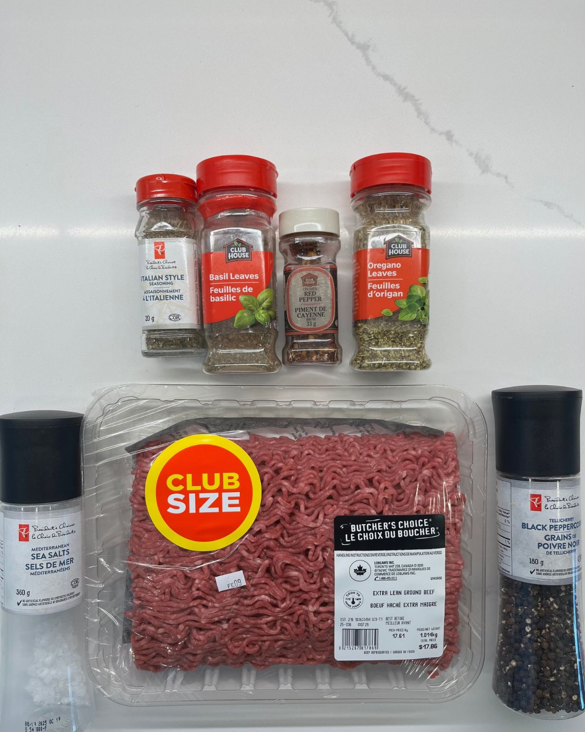 ground beef and spices laid out on table 