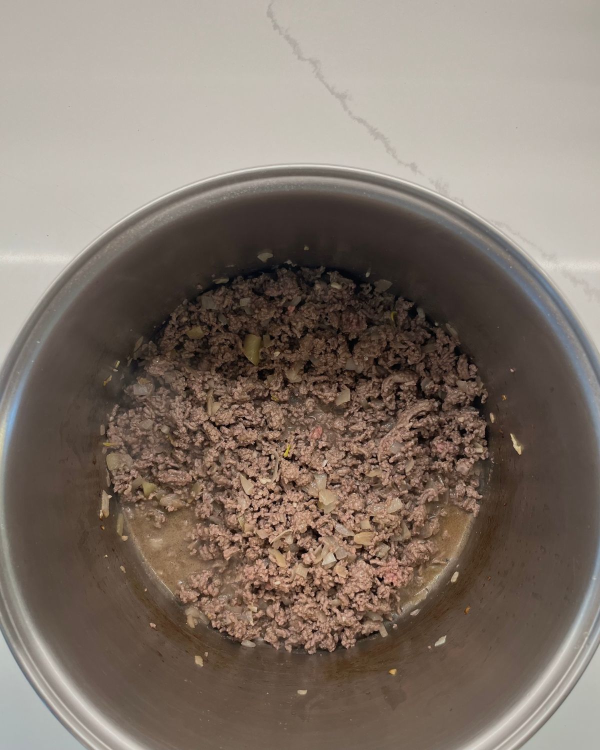 browned ground beef in pot 