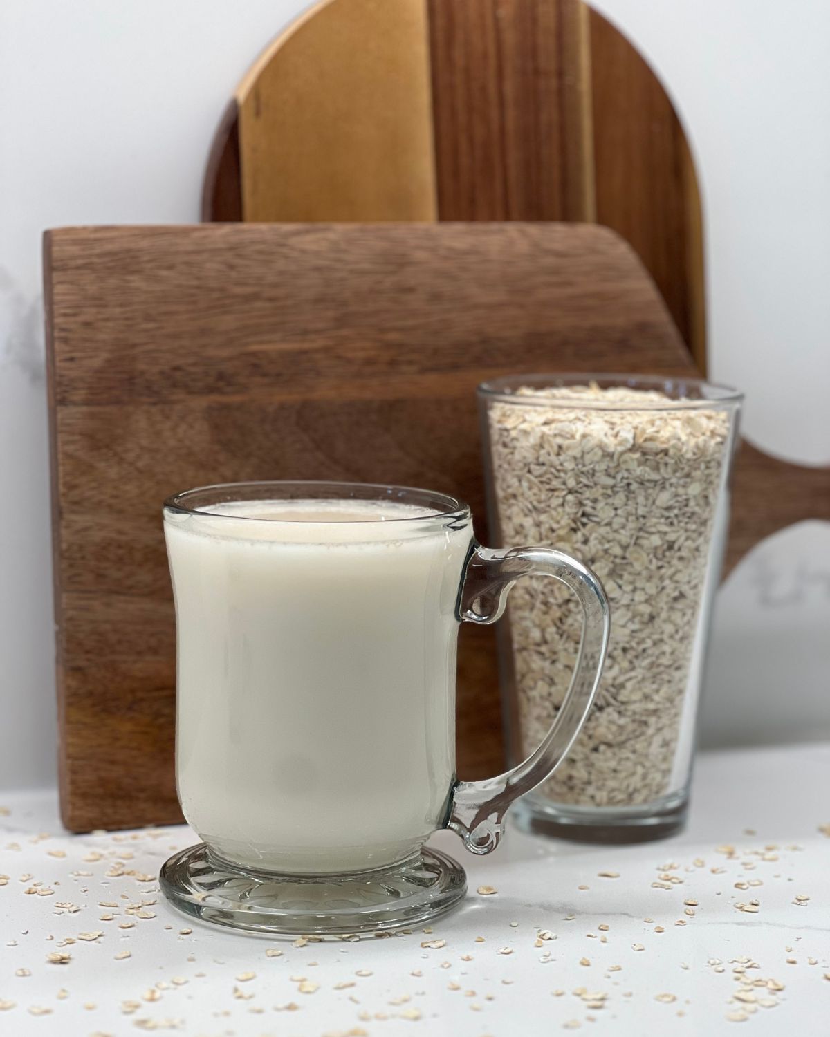 mug of oat milk with cup of oats 