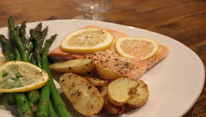 salmon, potatoes and asparagus on plate 