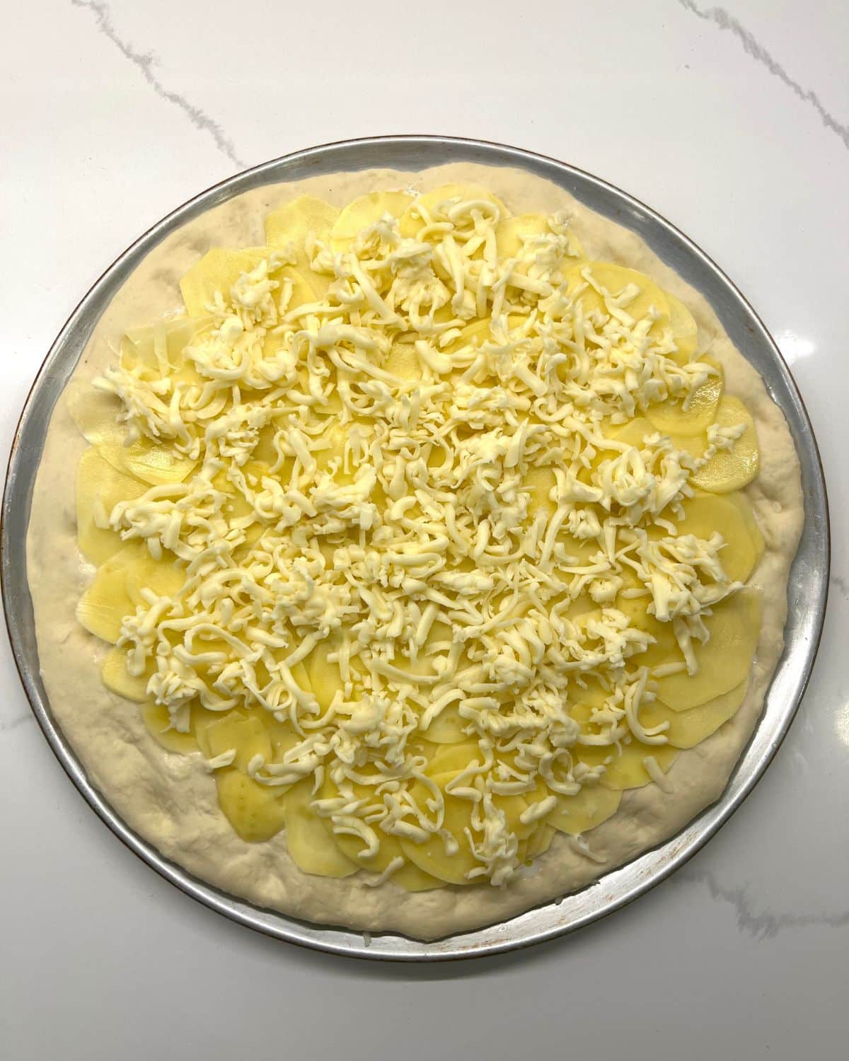 graded cheese adding on pizza
