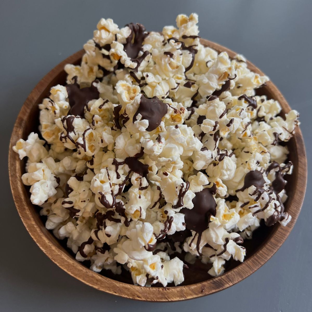 popcorn in bowl with chocolate on it