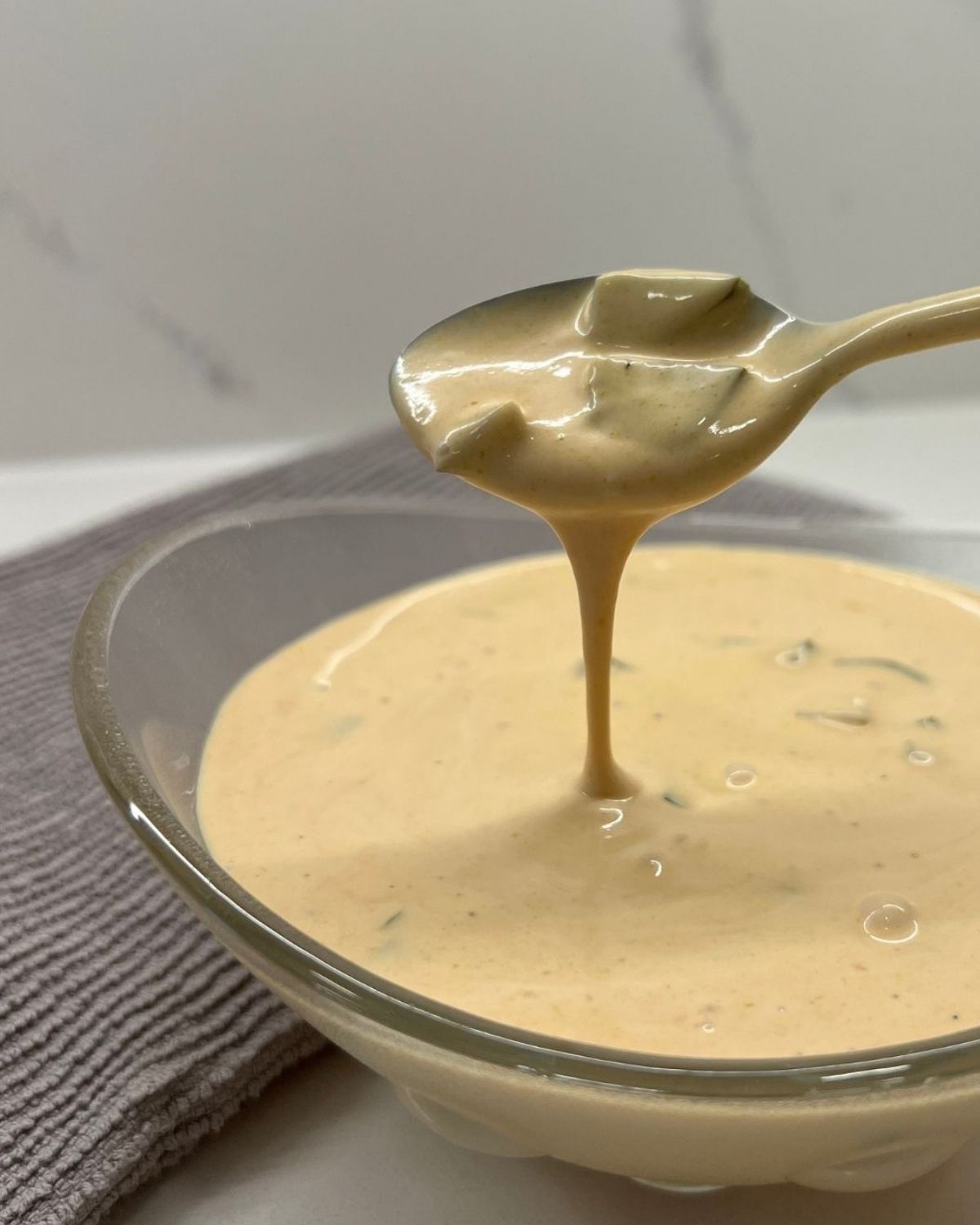 close up shot of the big mac sauce - scooping it out at camera 