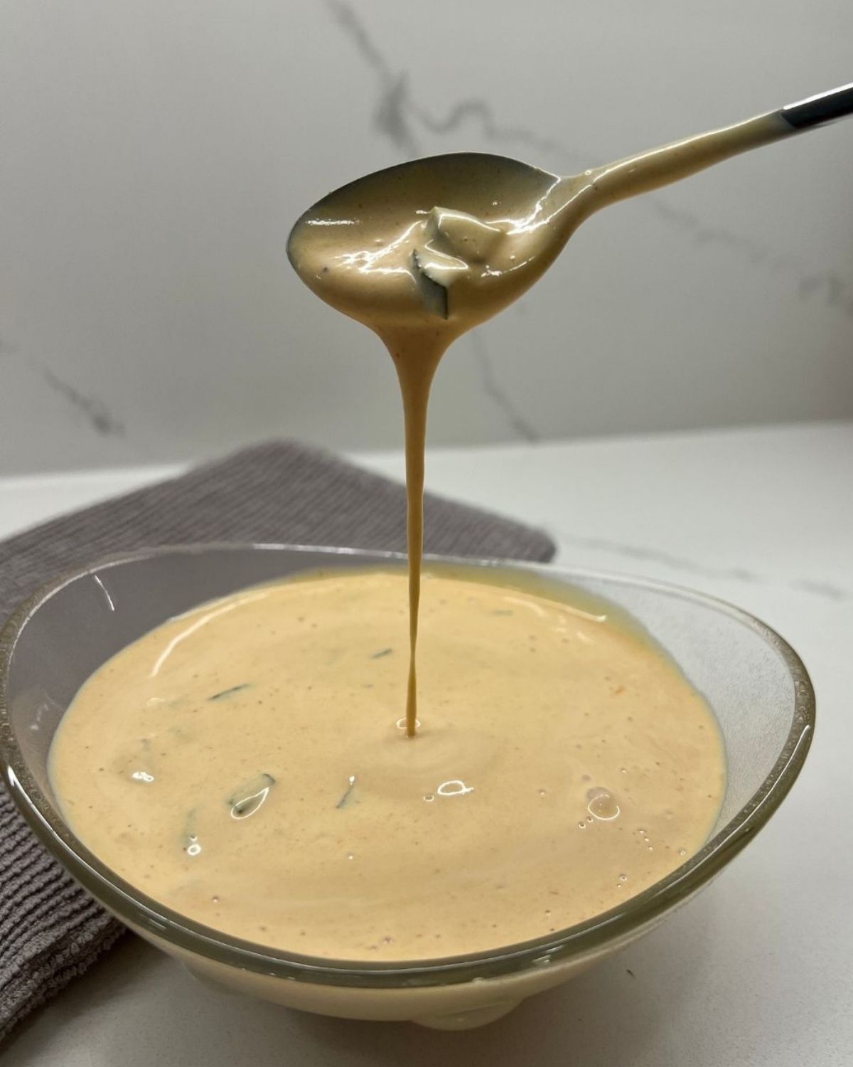 close up shot of the big mac sauce - scooping it out at camera 